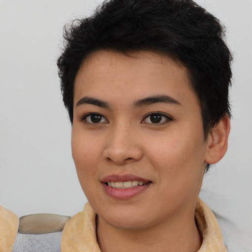 Joyful asian young-adult female with short  brown hair and brown eyes
