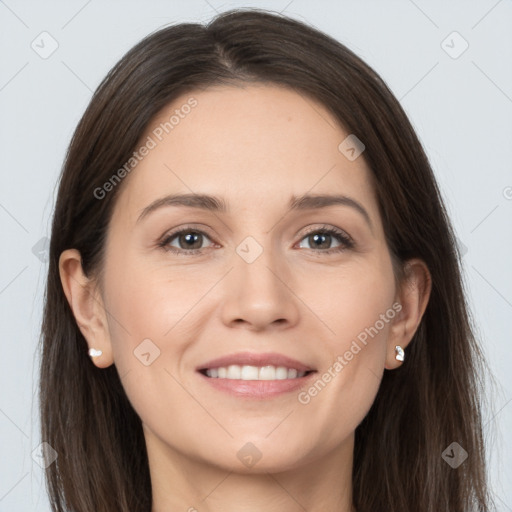 Joyful white young-adult female with long  brown hair and grey eyes