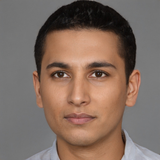 Neutral latino young-adult male with short  brown hair and brown eyes
