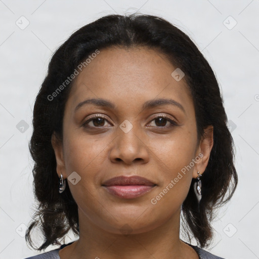 Joyful black young-adult female with medium  brown hair and brown eyes