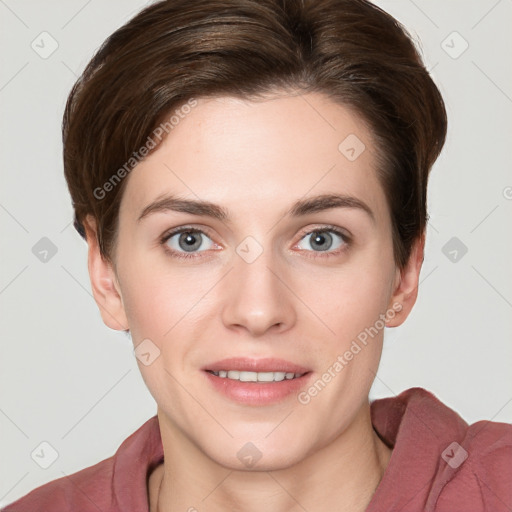 Joyful white young-adult female with short  brown hair and grey eyes