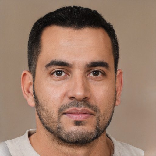 Neutral white young-adult male with short  black hair and brown eyes