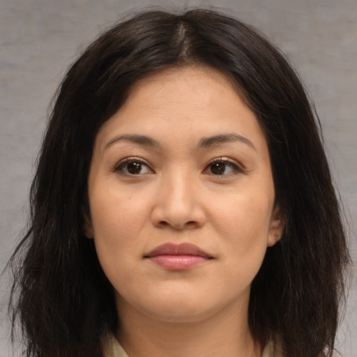 Joyful asian young-adult female with medium  brown hair and brown eyes