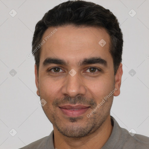 Joyful white young-adult male with short  black hair and brown eyes