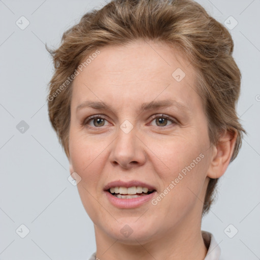 Joyful white adult female with short  brown hair and grey eyes