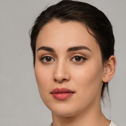 Joyful white young-adult female with medium  brown hair and brown eyes