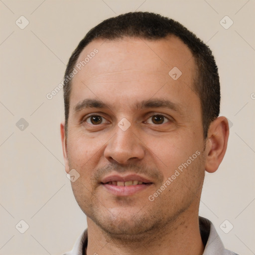 Joyful white young-adult male with short  brown hair and brown eyes