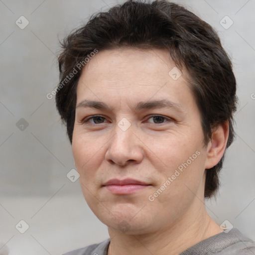 Joyful white adult female with short  brown hair and brown eyes