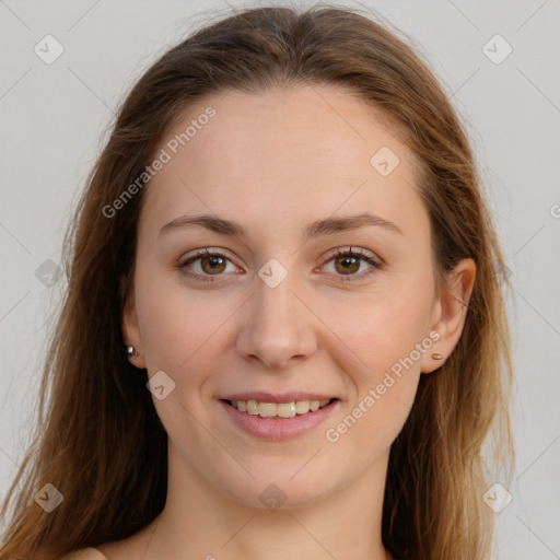 Joyful white young-adult female with long  brown hair and green eyes