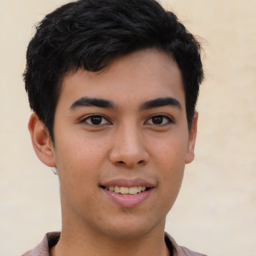 Joyful asian young-adult male with short  brown hair and brown eyes