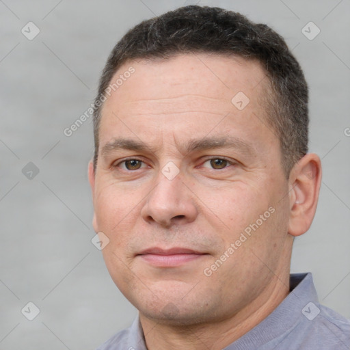 Joyful white adult male with short  brown hair and brown eyes