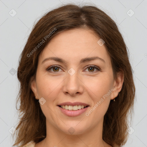 Joyful white young-adult female with medium  brown hair and green eyes