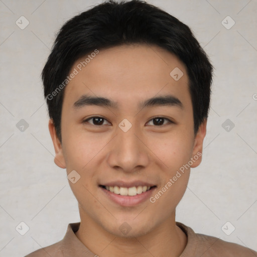 Joyful asian young-adult male with short  black hair and brown eyes