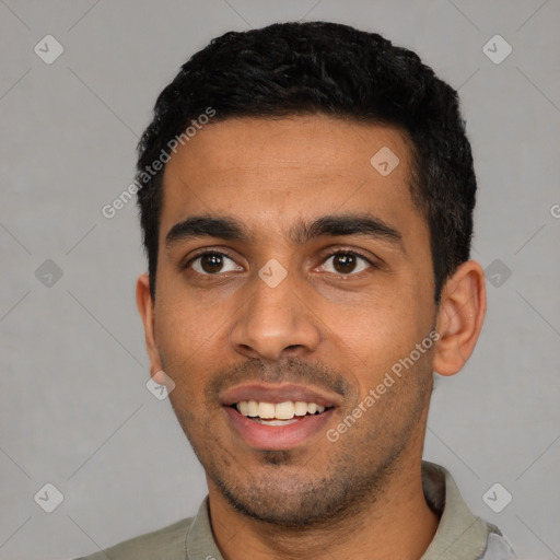 Joyful latino young-adult male with short  black hair and brown eyes