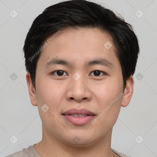 Joyful asian young-adult male with short  brown hair and brown eyes