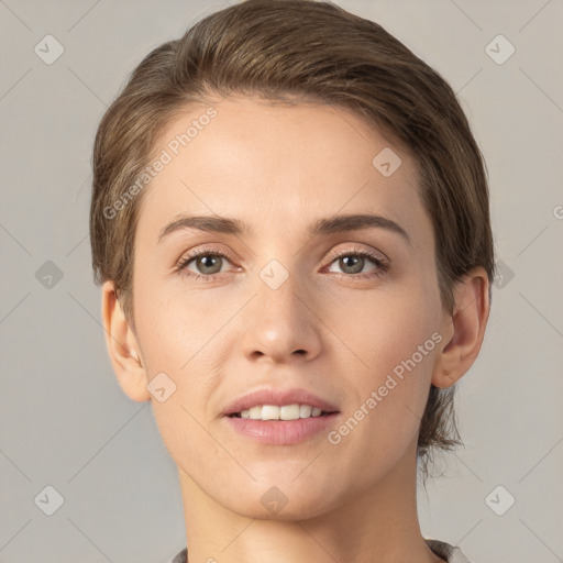 Joyful white young-adult female with short  brown hair and grey eyes