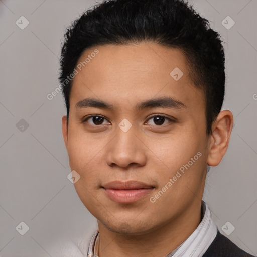 Joyful asian young-adult male with short  brown hair and brown eyes