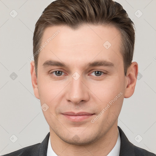 Joyful white young-adult male with short  brown hair and brown eyes