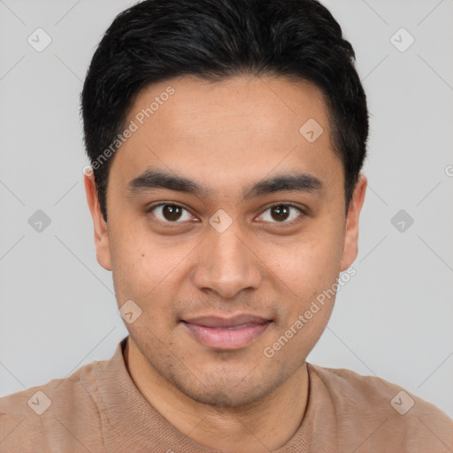 Joyful latino young-adult male with short  brown hair and brown eyes