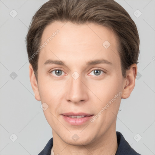 Joyful white young-adult male with short  brown hair and grey eyes