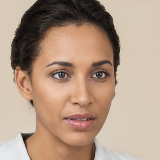 Joyful white young-adult female with short  brown hair and brown eyes