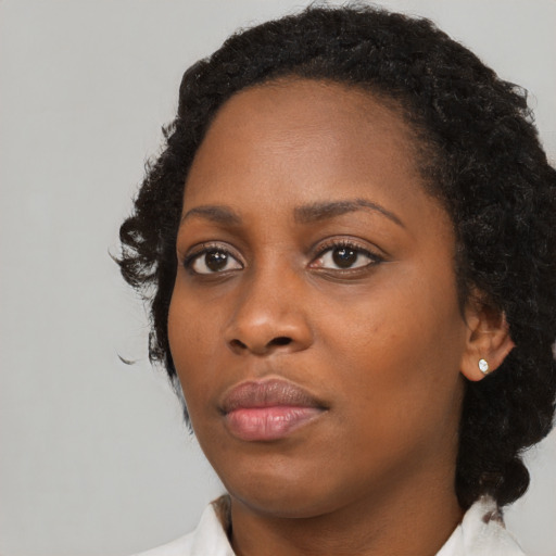 Neutral black young-adult female with medium  black hair and brown eyes