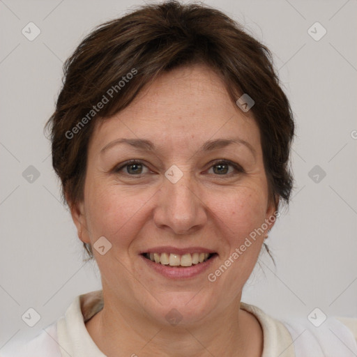 Joyful white adult female with short  brown hair and brown eyes