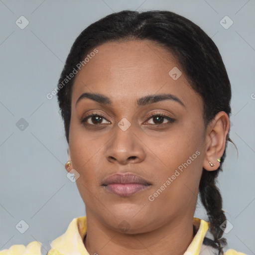 Joyful latino young-adult female with short  brown hair and brown eyes