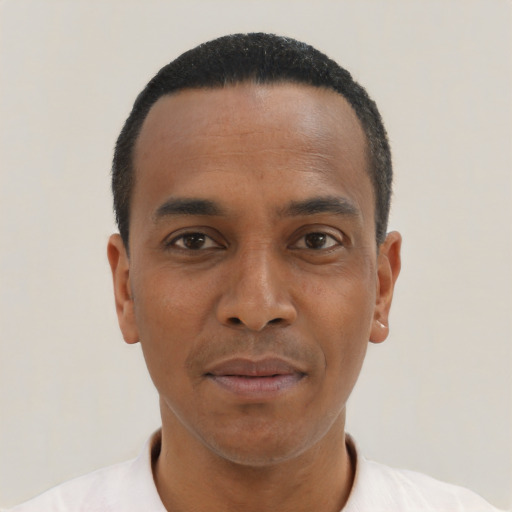 Neutral black young-adult male with short  black hair and brown eyes