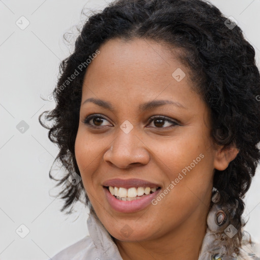 Joyful black young-adult female with medium  brown hair and brown eyes