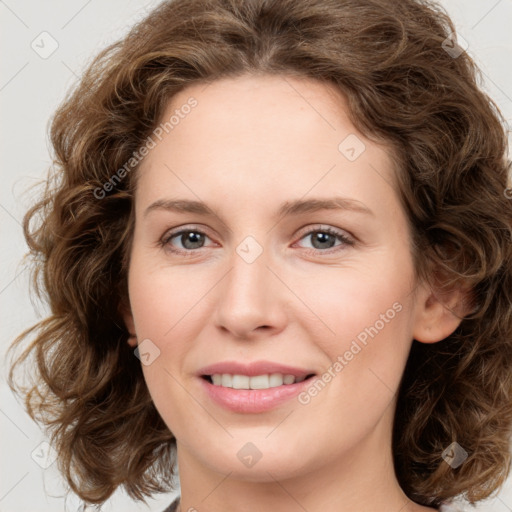 Joyful white young-adult female with medium  brown hair and green eyes