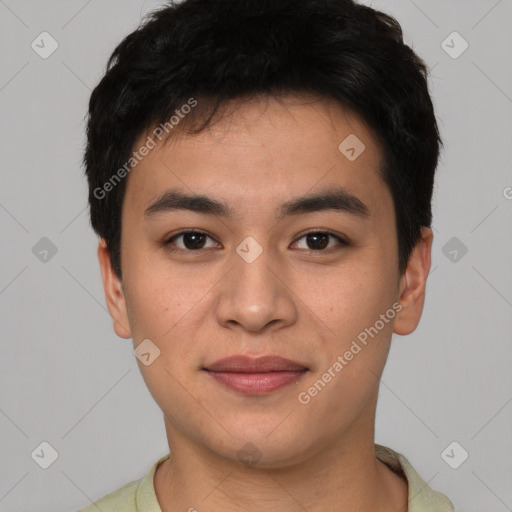 Joyful asian young-adult male with short  black hair and brown eyes