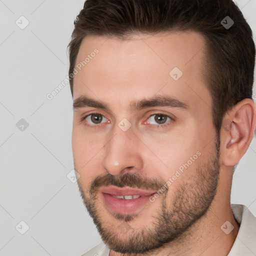 Joyful white young-adult male with short  brown hair and brown eyes