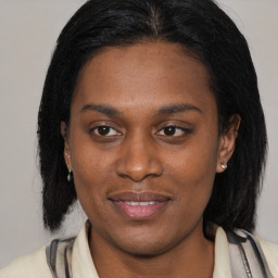 Joyful latino young-adult female with medium  black hair and brown eyes