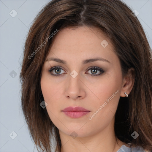 Neutral white young-adult female with long  brown hair and brown eyes