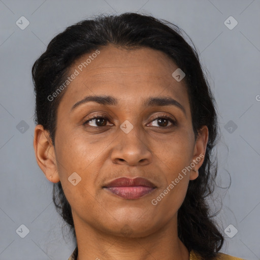 Joyful black adult female with medium  brown hair and brown eyes