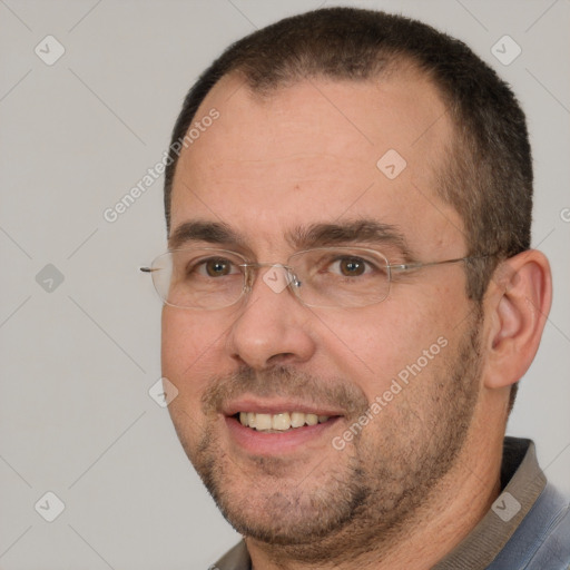 Joyful white adult male with short  brown hair and brown eyes