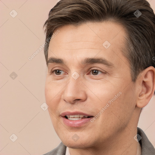 Joyful white adult male with short  brown hair and brown eyes