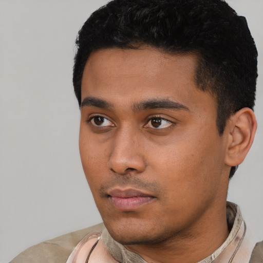 Neutral latino young-adult male with short  black hair and brown eyes