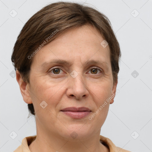 Joyful white adult female with short  brown hair and grey eyes