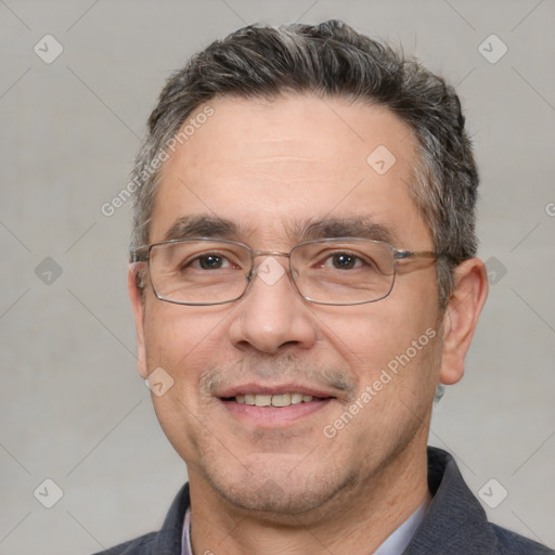 Joyful white adult male with short  black hair and brown eyes