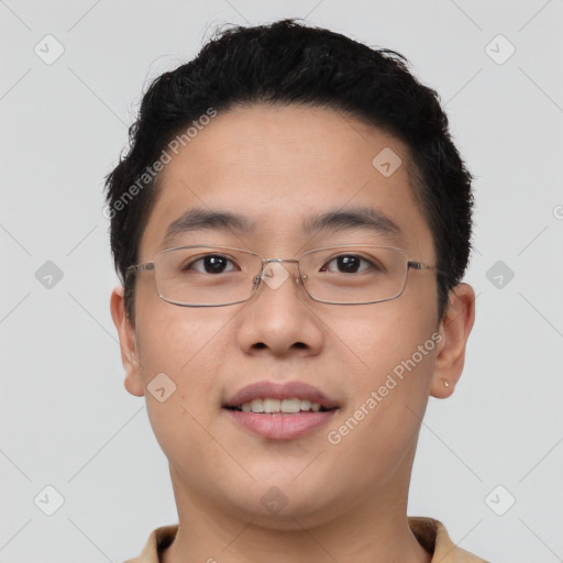 Joyful asian young-adult male with short  brown hair and brown eyes