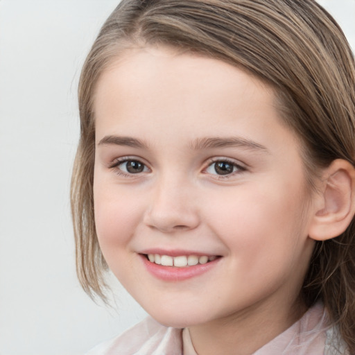 Joyful white child female with medium  brown hair and brown eyes