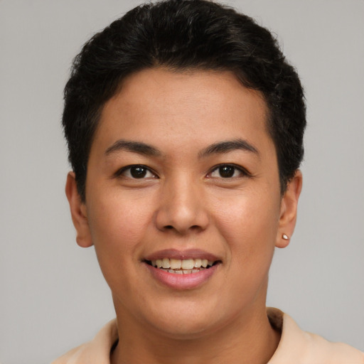 Joyful latino young-adult female with short  brown hair and brown eyes