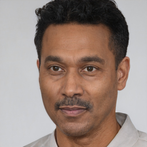 Neutral latino adult male with short  black hair and brown eyes