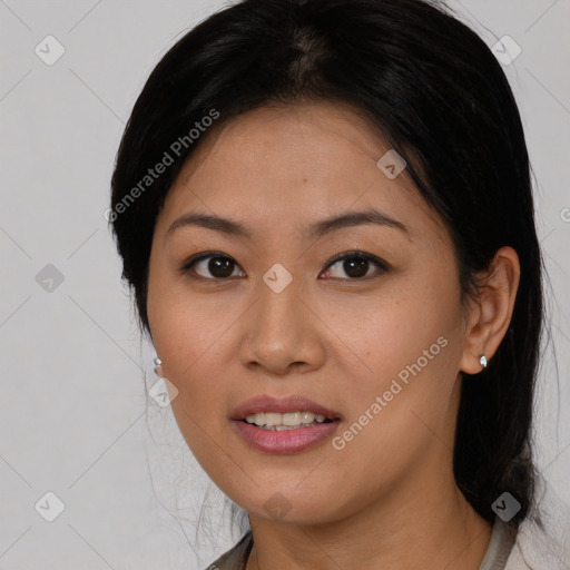 Joyful asian young-adult female with medium  black hair and brown eyes