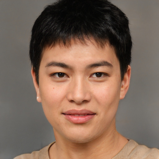 Joyful asian young-adult male with short  brown hair and brown eyes