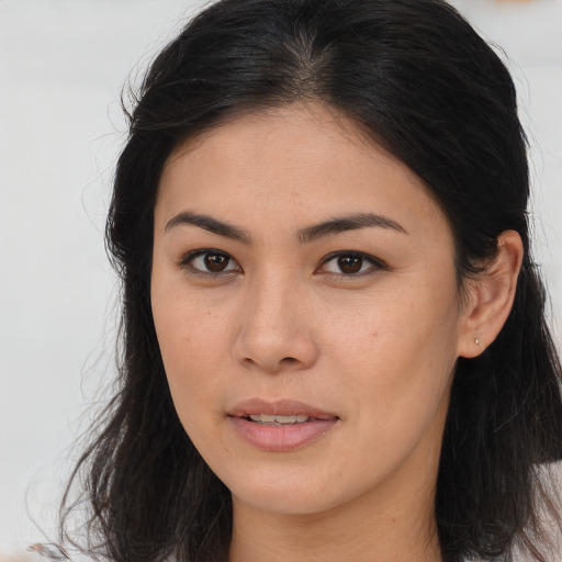 Joyful asian young-adult female with long  brown hair and brown eyes