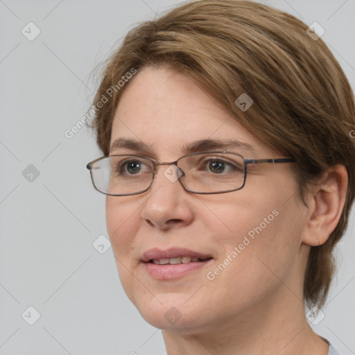 Joyful white adult female with medium  brown hair and grey eyes