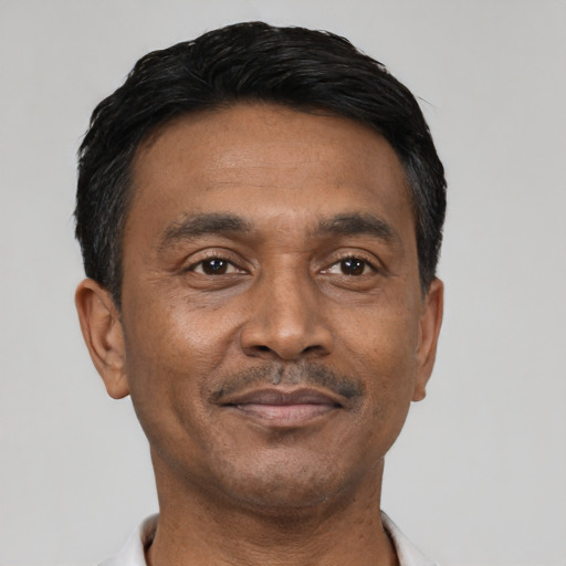 Neutral latino adult male with short  black hair and brown eyes
